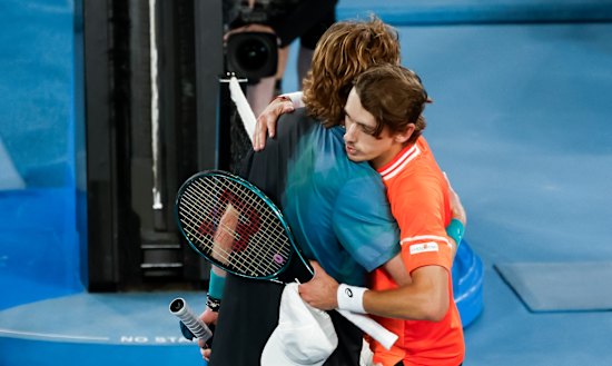 Rublev and de Minaur embrace at the net after their Australian Open clash last month.