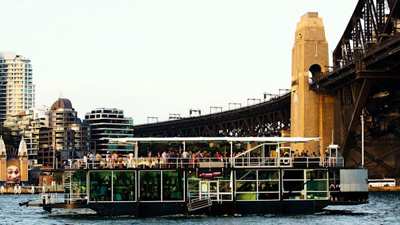 Party boats on the harbour are a time-honoured Sydney tradition. This photo shows a boat heading under the bridge in November 2014.