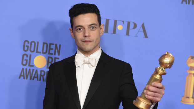 Rami Malek with the Golden Globe for best performance by an actor in a motion picture, drama.