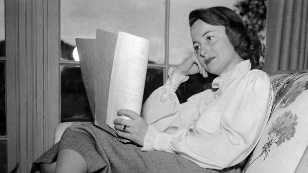 Olivia de Havilland reading a script in 1948. 