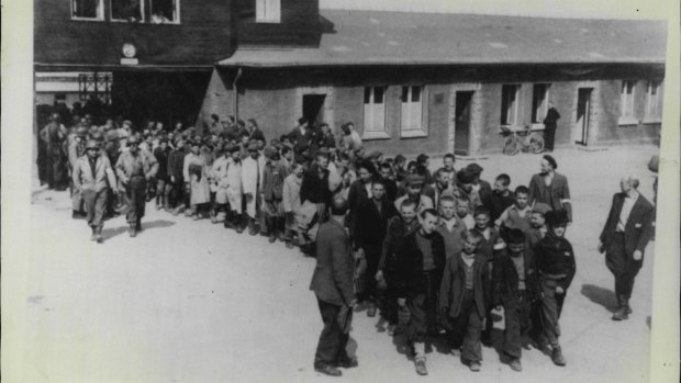 Prisoners at Buchenwald concentration camp, one of many camps across Nazi Germany, are pictured being freed in 1945.