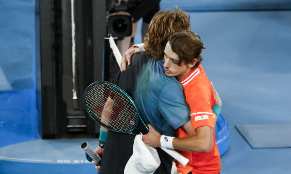 Rublev and de Minaur embrace at the net after their Australian Open clash last month.