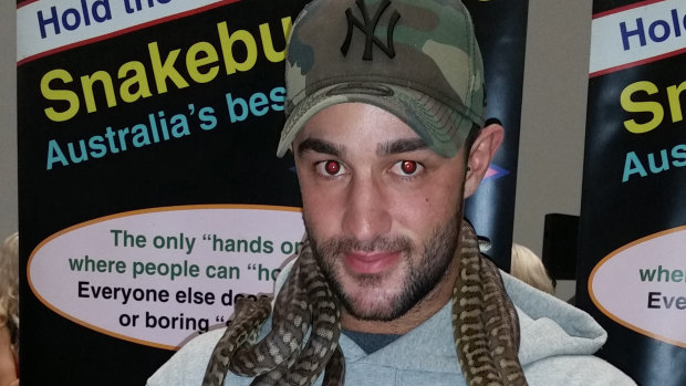 Matthew Gatt, 23, posing with snakes at the Melbourne Convention Centre in December. 
