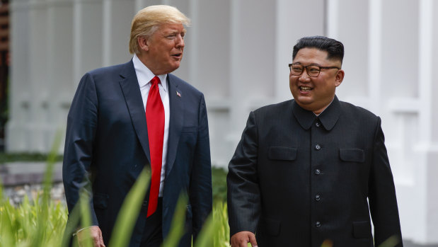 Donald Trump and Kim Jong-un chat after a day of meetings in Singapore.