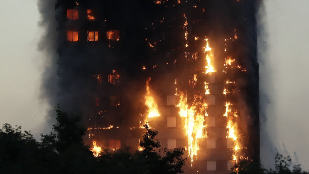 Smoke and flames rise from the Grenfell Tower building in June 2017.