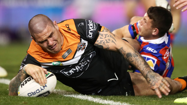 Too easy: Russell Packer shrugs off some soft Knights defence to score last night.
