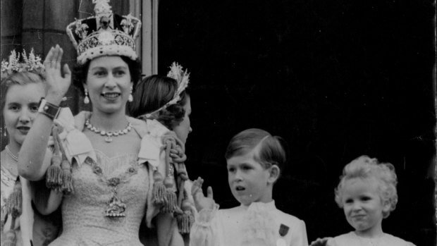 Queen Elizabeth with Prince Charles and Princess Anne on the balcony of Buckingham Palace after the coronation.