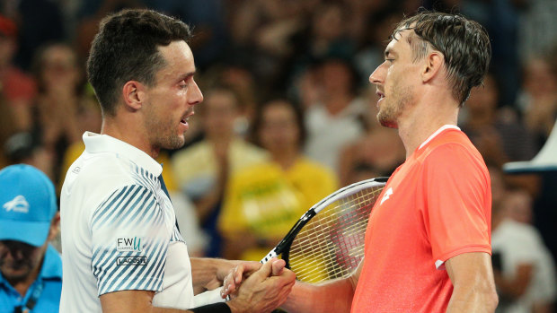 Respect: Roberto Bautista Agut shakes hands with John Millman.