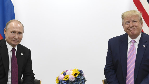 US President Donald Trump, right, meets with Russian President Vladimir Putin during a bilateral meeting on the sidelines of the G-20 summit in Osaka.