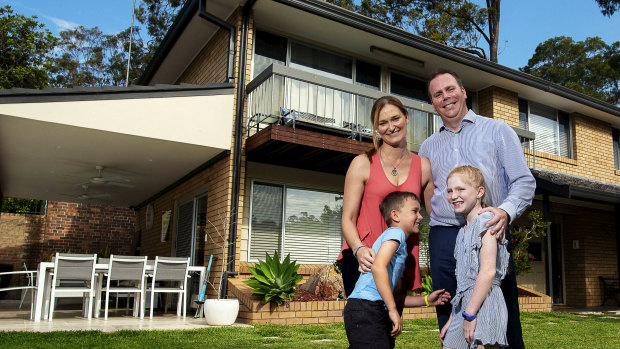 Mark and Julie Donovan, with their children Keira and Bailey at their solar-powered home in Grays Point.
