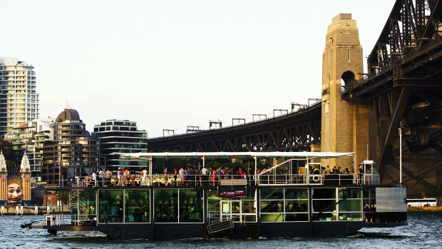 Party boats on the harbour are a time-honoured Sydney tradition. This photo shows a boat heading under the bridge in November 2014.