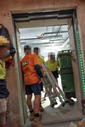 Builders working in close quarters at Multiplex's Collins Arch building site in Collins Street.