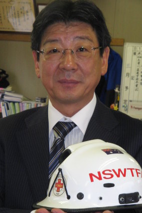 Minamisanriku mayor Jin Sato holds a treasured reminder of the immediate help Australia gave his town after the tsunami hit in 2011. 