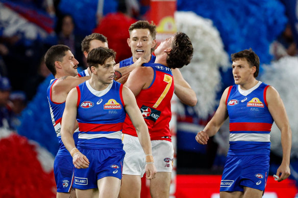 Tom Liberatore remonstrates with the close-checking Jarrod Berry.