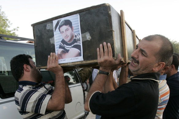 Namir Noor-Eldeen’s Reuters colleagues carry his coffin.