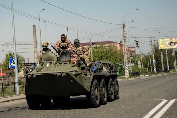 Ukrainian troops ride on top of an armoured personnel carrier in Kramatorsk, in the Donbas region of Ukraine.