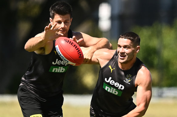 Dion Prestia (right, with Trent Cotchin) is set to return.
