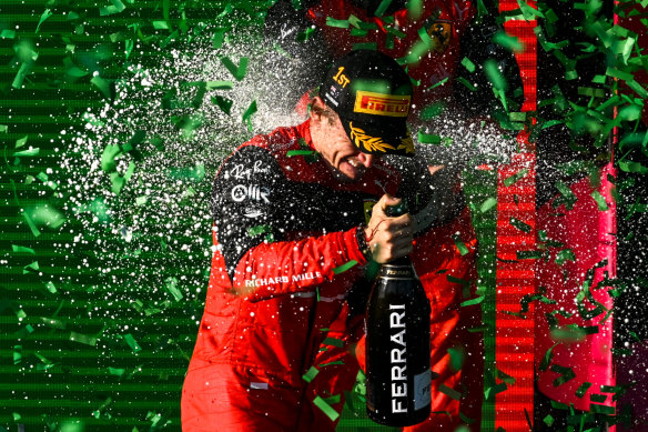 Charles Leclerc is showered in champagne.
