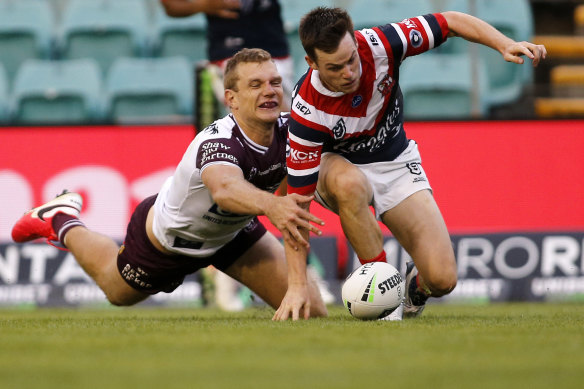Tom Trbojevic saves a certain try by knocking the ball from Luke Keary's grasp over the try line on Saturday.