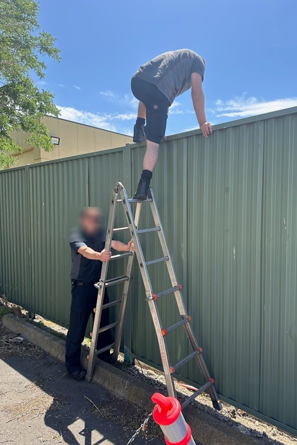 Two firefighters jumping the fence because of the 3G access issue.
