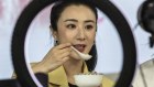 Livestreamer Huang Wei, known professionally as Viya, prepares to sample a bowl of food. In China livestream shopping is becoming a deeply embedded habit for consumers and an important tool for retailers.