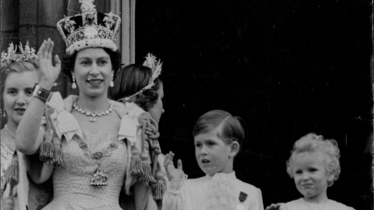 Queen Elizabeth with Prince Charles and Princess Anne on the balcony of Buckingham Palace after the coronation.