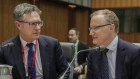 Reserve Bank governor Philip Lowe and his deputy, Guy Debelle. A price for holding rates too low. 