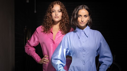 Models Cameron Stephens (left) in Bianca Spender and Bella Thomas in Scanlan Theodore ahead of Thursday’s David Jones parade.
