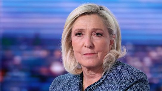 Far-right leader Marine Le Pen poses prior to an interview on the evening news broadcast of French TV channel TF1, after the court decision.