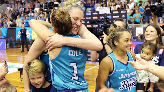 Lauren Jackson celebrates with teammates after the Southside Flyers clinched victory on Sunday.