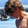 De Minaur prepares to hit with Jannik Sinner.