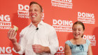 Premier Steven Miles and daughter Bridie at Labor’s campaign launch on Sunday. A pledge to offer free school lunches will cost $1.4 billion.