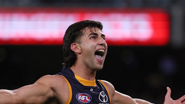 Josh Rachele of the Crows celebrates a goal.