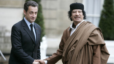 Nicolas Sarkozy, then President, greets Libyan leader Muammar Gaddafi in Paris in 2007.