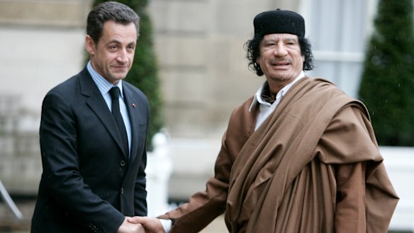 Nicolas Sarkozy, then President, greets Libyan leader Muammar Gaddafi in Paris in 2007.