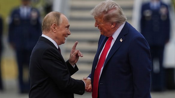 The Russian President and US President Donald Trump greet each other on the tarmac in Alaska last month.