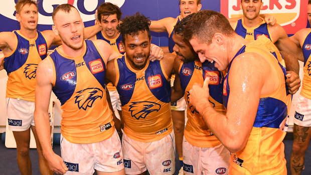 On song: West Coast players in full voice after their win over the Bulldogs.