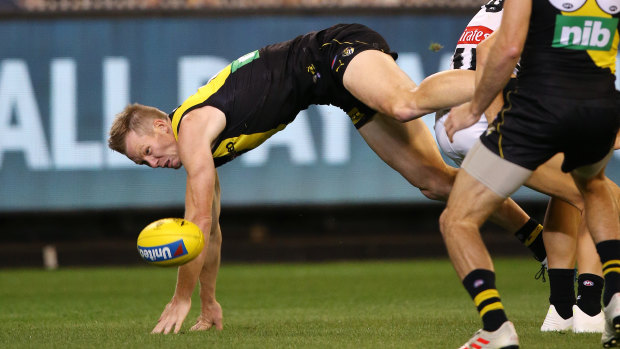 Hitting the turf: Richmond's Jack Riewoldt injured his wrist in this incident.