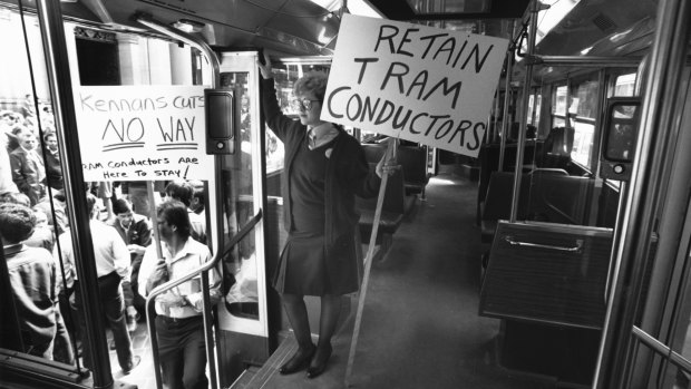 Ms Julie Di-Mieri makes her protest on board a tram in the Bourke Street Mall during a public transport stop work.