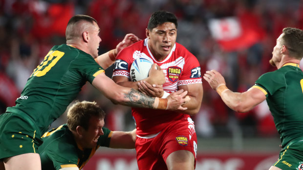 Tonga’s Jason Taumalolo tries to punch through a gap against the Kangaroos.