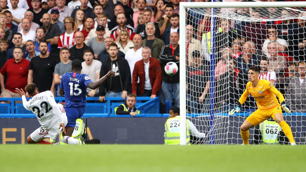 Self-inflicted: Kurt Zouma of Chelsea scores an own goal during Sheffield United's upset draw at Stamford Bridge.