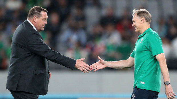 Head to head: Steve Hansen greets his Ireland counterpart and countryman, Joe Schmidt, before their quarter-final.