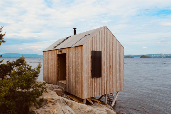 A wooden sauna on the edge of the coast in Nesodden, Norway. 