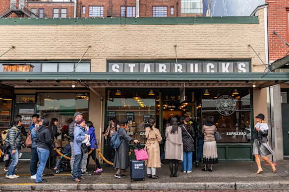 Serving coffee since 1912 … queues stretch down the street for the original Starbucks store in Pike Place.