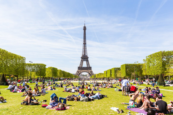 Admire the tower from the ground at the Champs de Mars.