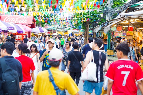 The morning shoppers descend the weekend market in Chatuchak, also known JJ market.