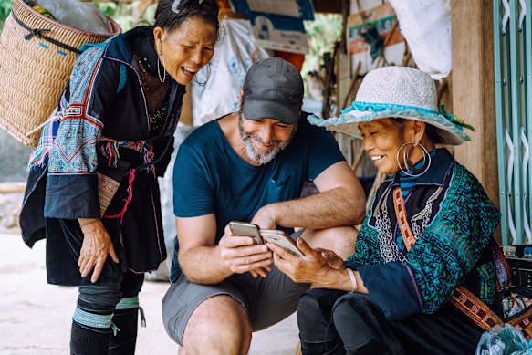 Sharing family photos is a sure way to make a connection with the locals in certain countries.