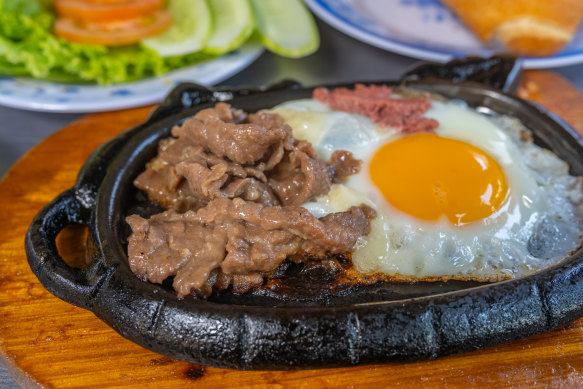 Vietnamese steak and eggs, known as  “bo ne” or “dodging beef”.