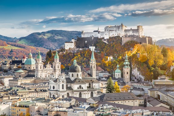 Aerial view of the historic city of Salzburg with Hohensalzburg Fortress in beautiful evening light in fall, Salzburger Land, Austria. 