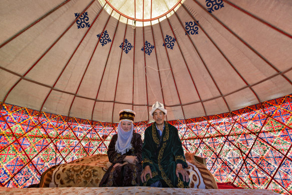 Kyrgyz couple in a nomadic tent known as yurt, near the city of Bishkek, Kyrgyzstan. 